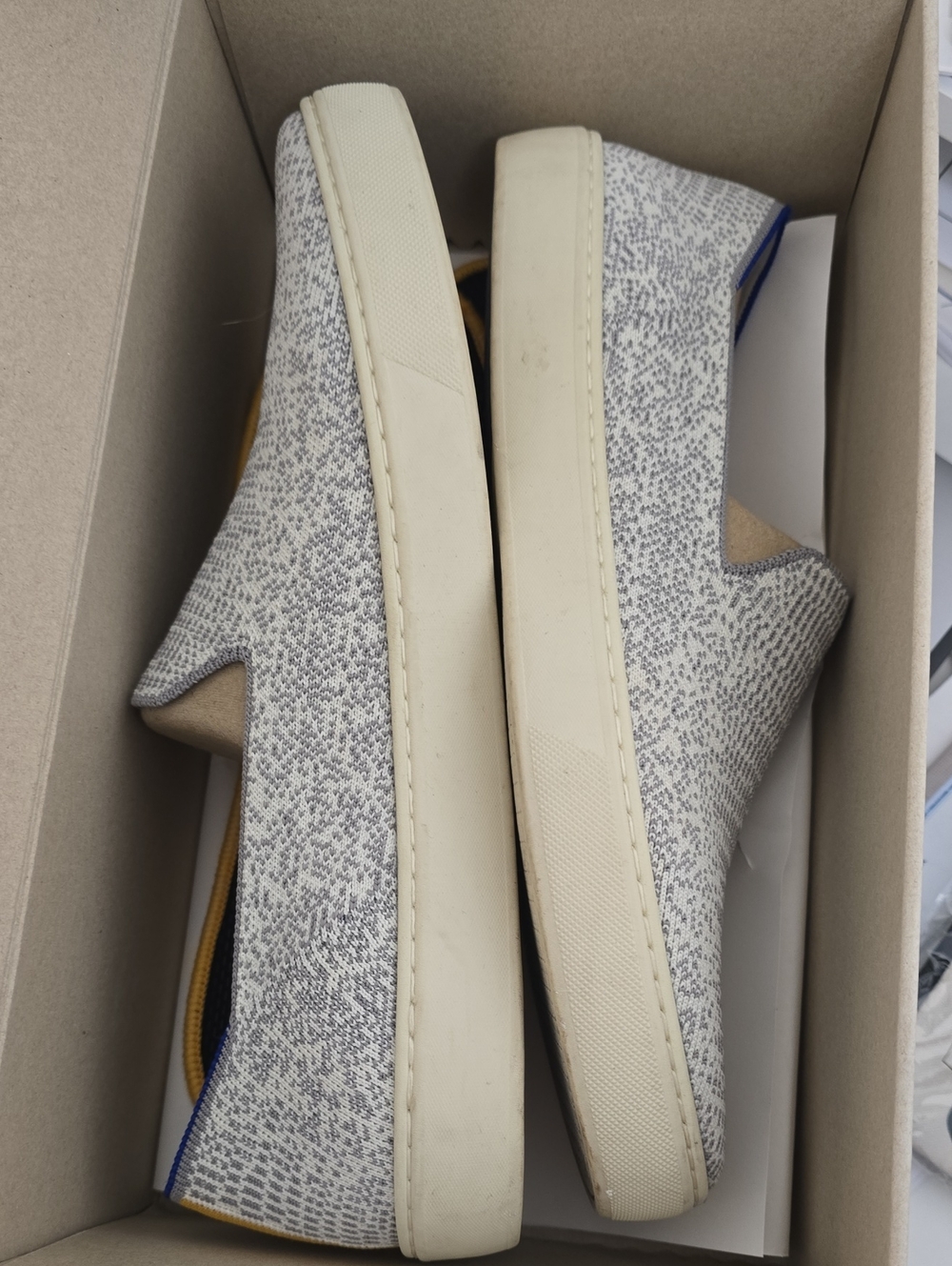 Rothy's Knit Slip-On Sneakers in Heathered Gray and Cream with Blue Trim